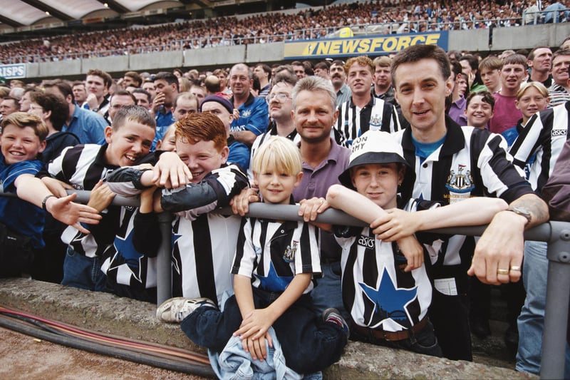 Newcastle United fans smile for the camera before the opening game of the 1993/94 Premier League season against Tottenham Hotspur at St James' Park.