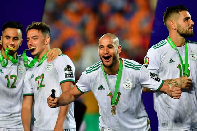 Algeria's forward Adam Ounas, Algeria's midfielder Ismail Bennacer, Algeria's midfielder Adlene Guedioura and Algeria's forward Andy Delort celebrate after winning the 2019 Africa Cup of Nations (CAN) Final football match between Senegal and Algeria at the Cairo International Stadium in Cairo: GIUSEPPE CACACE/AFP via Getty Images