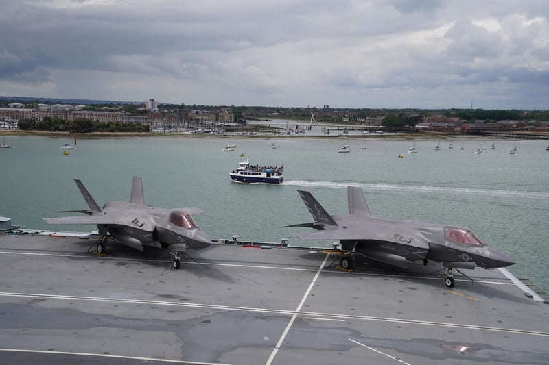 A pair of F-35B Lightning II jets on the flight deck during Queen Elizabeth II's visit to HMS Queen Elizabeth at HM Naval Base, Portsmouth, ahead of the ship's maiden deployment. The visit comes as HMS Queen Elizabeth prepares to lead the UK Carrier Strike Group on a 28-week operational deployment travelling over 26,000 nautical miles from the Mediterranean to the Philippine Sea. Picture date: Saturday May 22, 2021. PA Photo. See PA story ROYAL Carrier. Photo credit should read: Steve Parsons/PA Wire