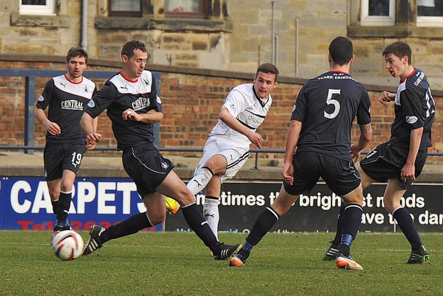 Lewis Vaghan threads a shot through the Falkirk defence