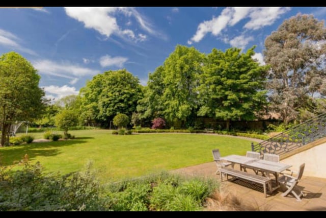 At the front and side of the property you’ll find manicured lawns with well-stocked herbaceous borders, while at the back lies a generous landscaped garden with mature specimen trees, a stone-built wood fired pizza oven, barbecue area and an upper terrace.