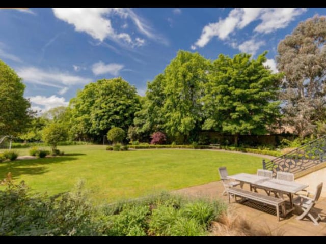 At the front and side of the property you’ll find manicured lawns with well-stocked herbaceous borders, while at the back lies a generous landscaped garden with mature specimen trees, a stone-built wood fired pizza oven, barbecue area and an upper terrace.