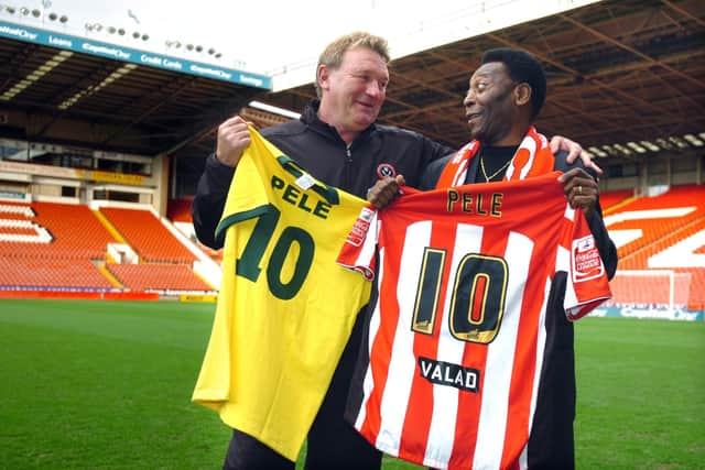 Pele at Bramall Lane, meets up with Tony Currie fighting for the ball.