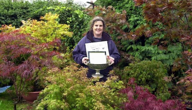 Pat Gibbons with her award winning Japanese Maples that won big at the Harrogate Autumn Flower Show in 2001.