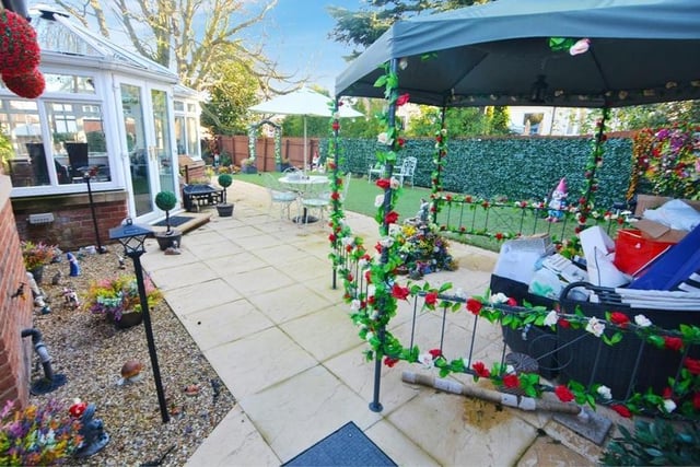 And so we move outside, where a large, wraparound, landscaped garden adds to the appeal of the property. A spacious patio area is ideal for outdoor seating and entertaining family and friends. Space too for a barbecue.