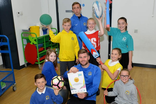 Barnard Grove Primary school PE teacher Craig Weatherill holds the sports certificate at a 2009 event at the school. Are you in the picture?