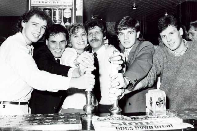 Pulling the first pints at the official re-opening after refurbishment of the Arbourthorne Hotel are Sheffield Wednesday and United FC players, left to right: Mel Sterland, Gary Shelton (Sheffield Wednesday), Josie and Terry Fisher (landlady and landlord), Charlie Williamson (Sheffield Wednesday) and Russell Black (Sheffield United), December 1981