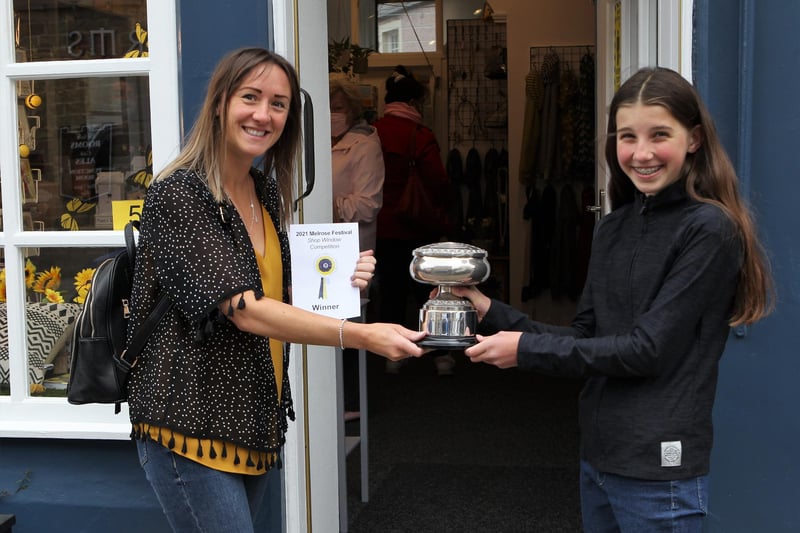 Melrose Festival Queen Lucy Whiting presents the award for the best dressed window to Kirsty McDade, owner of Butterfly.