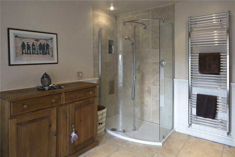 Well-appointed with a white suite comprising a roll-top bath, matching pedestal wash basin and WC. There is also a fully tiled shower unit.