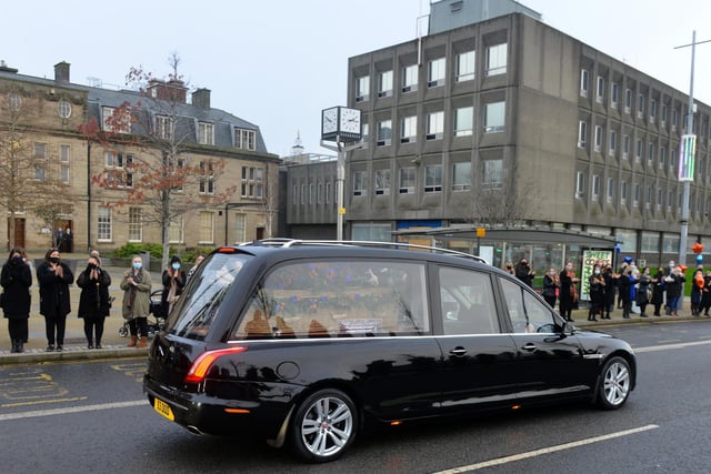 The funeral cortege for John Hays passes through Keel Square as Hays Travel staff pay respect.