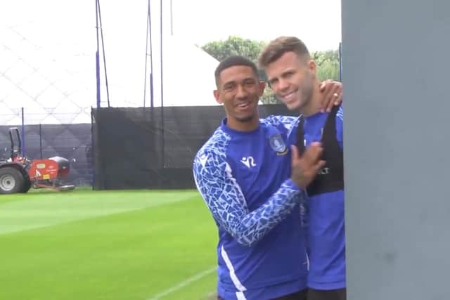 Liam Palmer and Florian Kamberi share a lighter moment during Sheffield Wednesday training.