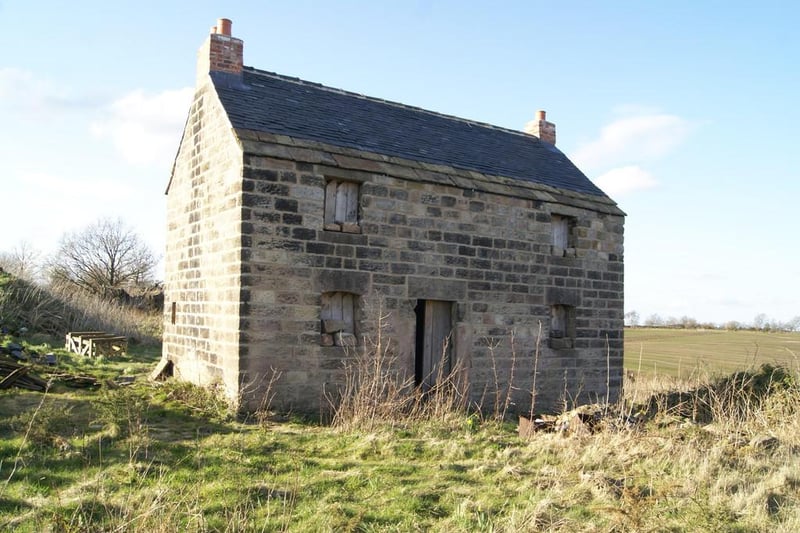 The property includes "a number of substantial stone-built outbuildings".