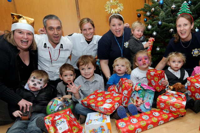 Staff from the Burns Unit at Sheffield Children's Hospital with guests from South Yorkshire Fire & Rescue Service and young burns victims from the unit at their 2010 Christmas party at Ponds Forge