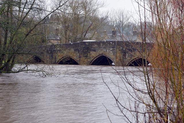 Not much of the bridge is visible as the water levels rise in Bakewell.