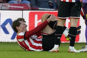 Sander Berge of Sheffield United was in some pain after a late challenge against Coventry City: Andrew Yates / Sportimage