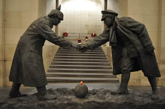 Andy Edwards' truce statue All Together Now at the Menin Gate British war memorial in Ypres, Belgium