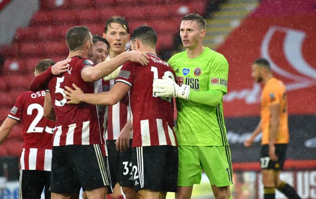 Sheffield United's John Egan (centre) celebrates with team-mates after the final whistle: Rui Vieira/NMC Pool/PA Wire