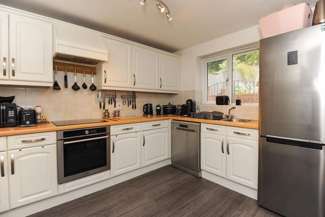 This large, attractive kitchen is fully equipped and has lots of storage space. It's the perfect place to cook up a meal for all the family.