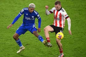 Oliver McBurnie of Sheffield United battles for possession with Wesley Fofana of Leicester City (Photo by Michael Regan/Getty Images)