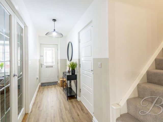 Back into the lovely entrance hallway, with its laminate flooring, as we prepare to head upstairs.