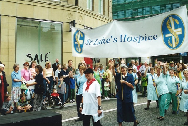 Supporters of St Luke's Hospice parade through Sheffield city centre