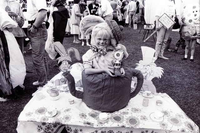 The White Rabbit is enjoying  the Mad Hatter's Tea Party during the children's fancy dress parade at the Gala in Graves Park in 1990