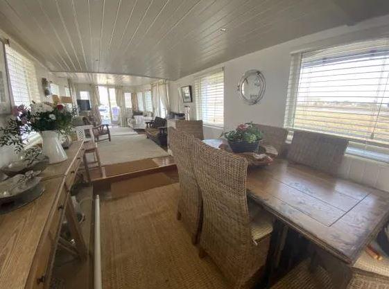 There is an open plan dining area leading to the lounge.