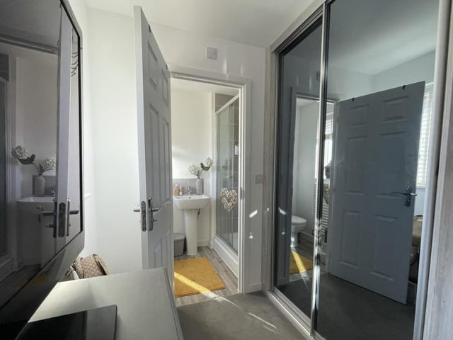 Both the master bedroom and the second bedroom boast fitted wardrobes with tinted glass sliding doors.