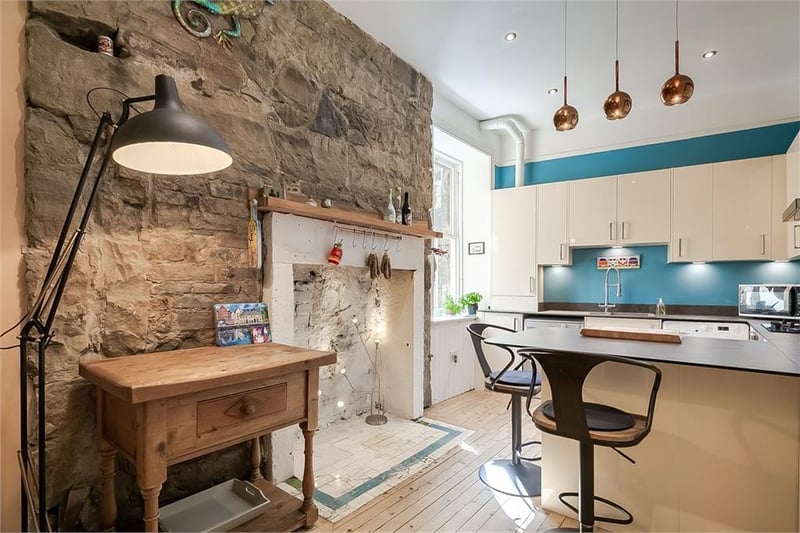 Feature stone wall in kitchen.