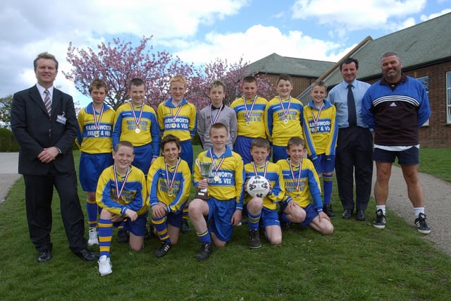 Headteacher Ken Gibson, left, with coaches and the school's Year 7 footballers in 2005.