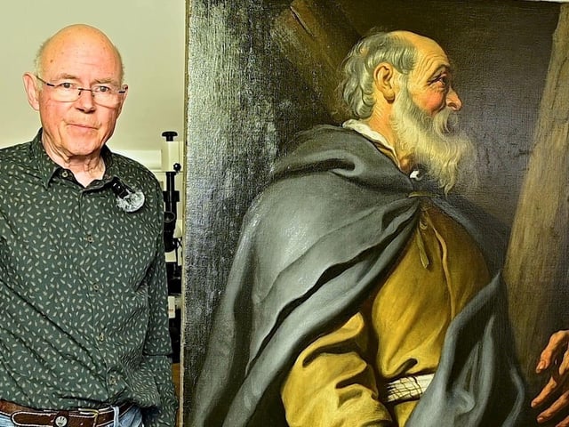 Art restorer Martin Wylde with the painting of St Andrew