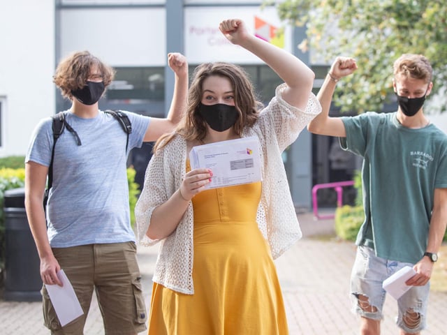 Daniel Bayliss, Chloe Cotterill and Daniel Hill celebrating their results at Portsmouth College.  Picture: Habibur Rahman