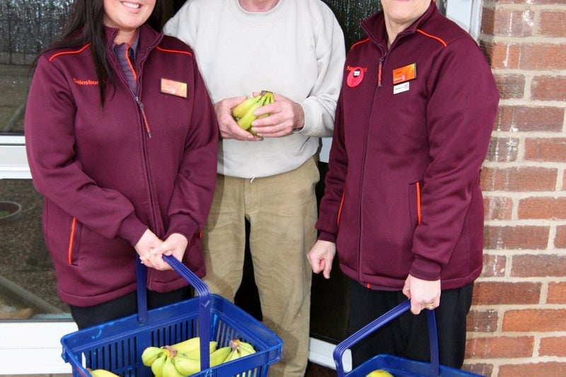 To celebrate Fairtrade Fortnight 2011, Sainsbury’s very own Bananamen/women swung by to deliver free Fairtrade bananas to residents of Acacia Road in Doncaster, the fictional home of childhood superhero Bananaman. People in photo (left to right): Andrea Needham, Gordon Bennett, Joyce Evans.