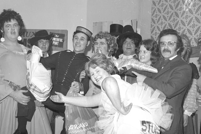 Staff from Hepworth and Grandage in a scene from their 1974 Christmas panto - Cinderella. The glass slipper was specially made for the production by Pyrex.