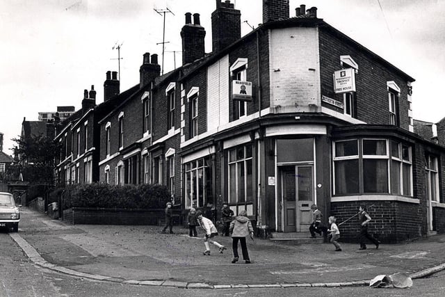 Childrey play outside the Catherine Arms public house, Brotherton Street, Burngreave, in October 1974