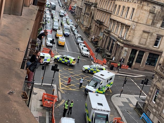 Armed police, sniffer dogs and officers carrying riot shields have all been spotted assisting with the ongoing incident