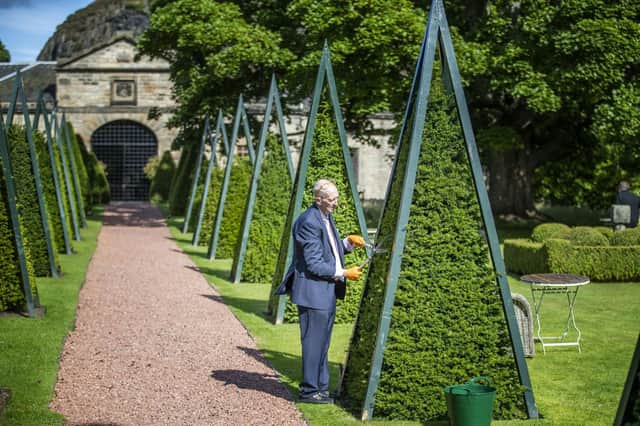 Owner James Thomson works in the gardens making last minute preparations at Prestonfield House in Edinburgh before the hotel reopens tomorrow