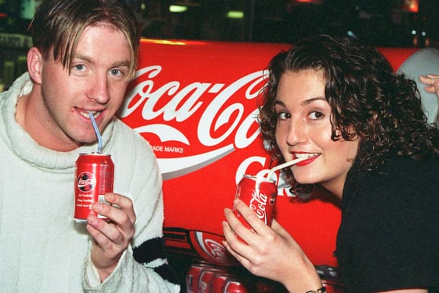 Kay Roberts, 23, collects her 365 cans of Coca-Cola courtesy of Karisma nightclub pictured with Doncaster Rovers player Colin Cramb in 1997