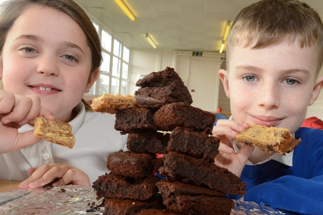 Lyla Simpson, 8, and Shaun Dennis, 9, were impressed with the tower of brownies at the Eskdale Academy Fairtrade Coffee Morning four years ago.