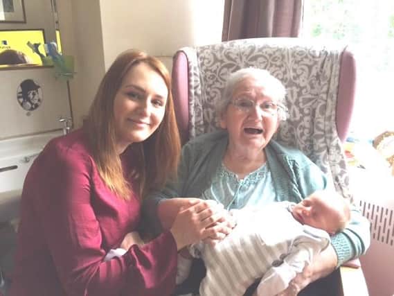 Sheffcare volunteer Laura Buck with her baby Arthur and Sheffcare resident Liz