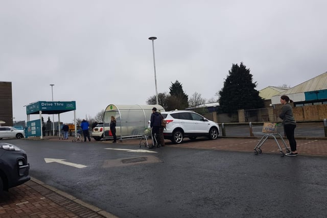 Shoppers pictured up to two car parking spaces apart from each other as they queue outside supermarkets across Scotland. As of today COVID-19 cases reached 894 and three more patients died after contracting the virus making the death toll 25.