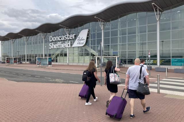 Passengers head to the check-in desk on their way into Doncaster Sheffield Airport. Credit: George Torr/LDRS