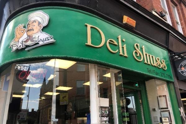 On Church Street, Deli Shuss offers a variety of hot sandwiches, pastries, toasties, and box plate salads. A bacon sandwich or a sausage sandwich can be bought for £2.60, and all sandwiches are served on a choice of brown or white bread.