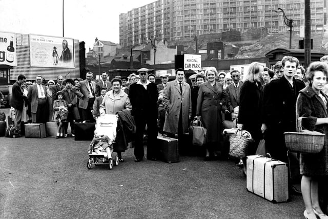 Holidaymakers queue at Sheffield's Pond Street bus station on a bank holiday weekend in 1962 to catch their seaside-bound coaches