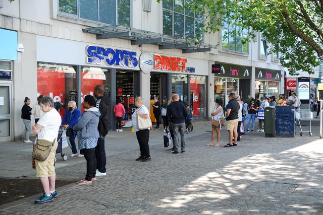 Queuing for Sports Direct in Commercial Road, Portsmouth. Picture: Sarah Standing (150620-9963)