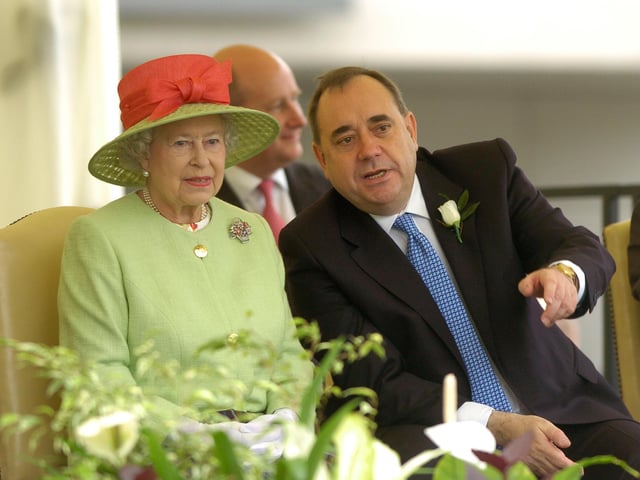 Her Majesty Queen Elizabeth II at the opening of the third Scottish Parliament at Holyrood, Edinburgh in 2007. The Queen watches the procession walk past along with then First Minister Alex Salmond.