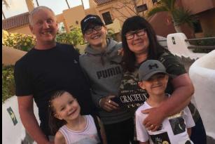 Pat Johnston's birthday is on March 27 - she works at the Asda in Carcroft and will be working on her special day. In this photograph, she is with her grandchildren.