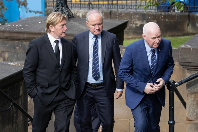 Former Gers players Stuart McCall and John Brown make their way into the church
