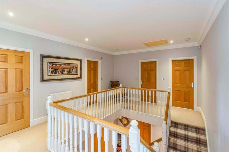 First floor landing  - From the entrance hall, stairs rise to a stunning galleried landing. With a central heating radiator.