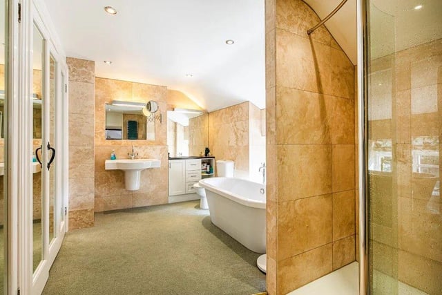 Elegant tiles frame the bathroom suites.